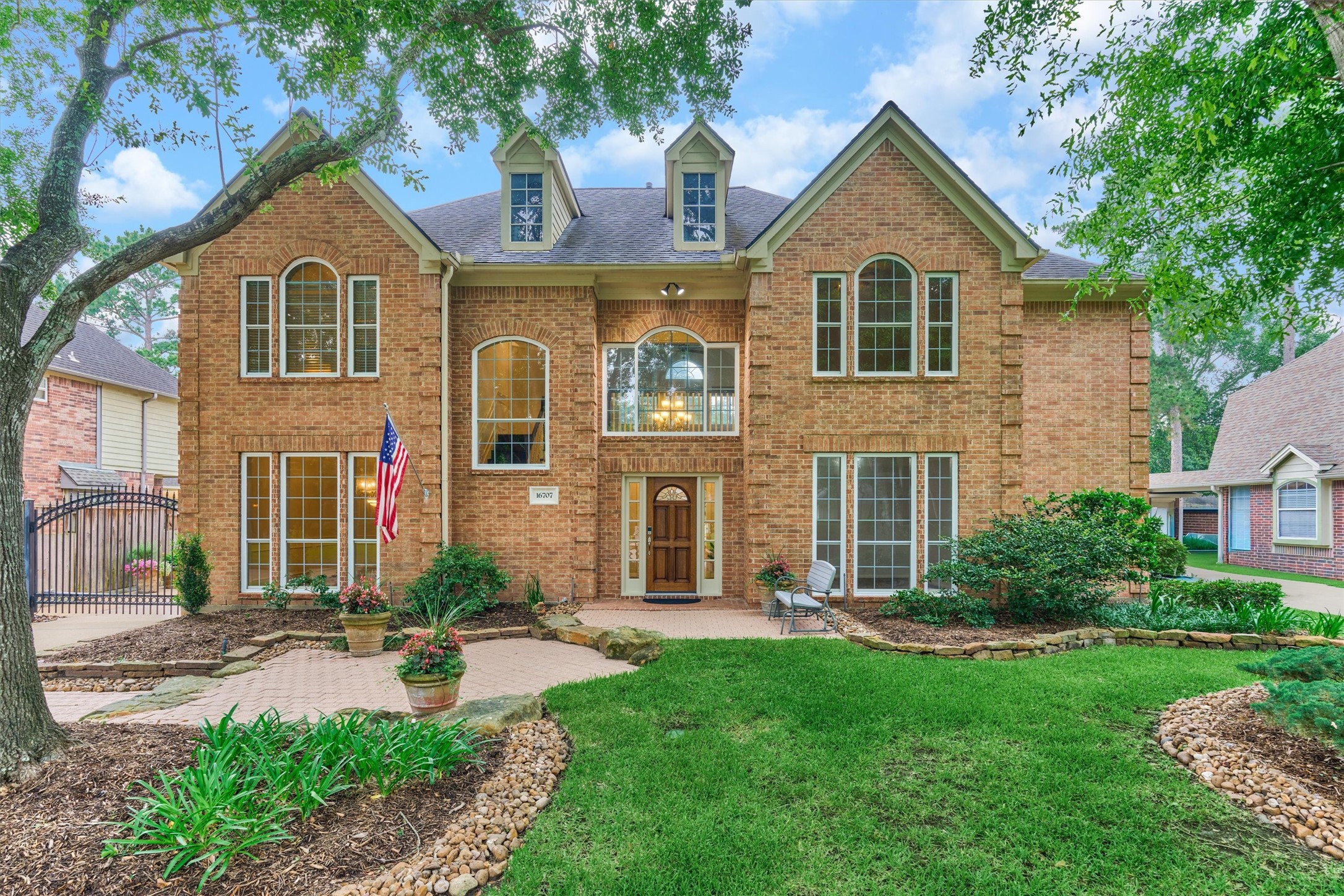 16707 Avenfield Road Tomball, TX 77377 - Photo 1 of 50 a front view of a house with a yard and garage