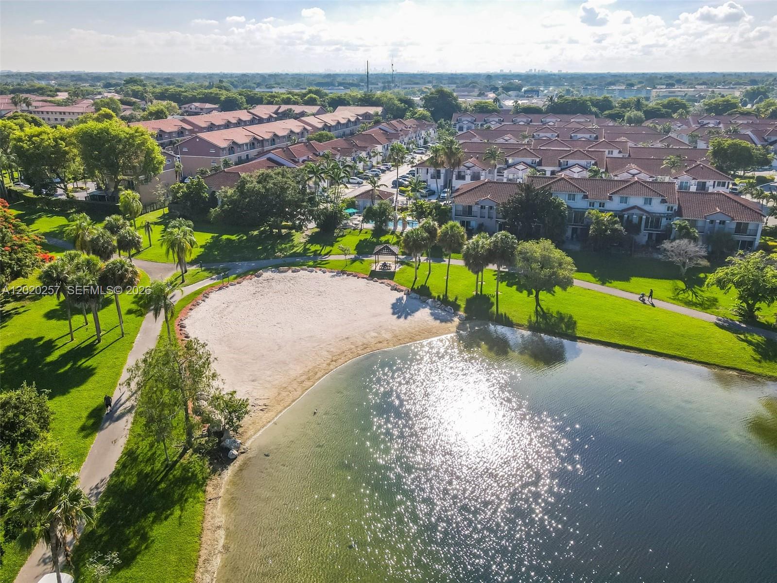 10245 Southwest 154th Place, Unit 1123 Miami, FL 33196 - Photo 36 of 38 a view of a lake with a city