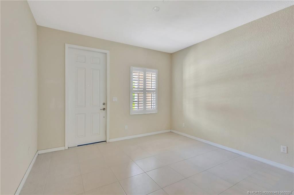 144 Southwest Otter Run Place Stuart, FL 34997 - Photo 15 of 20 a view of an empty room with a window