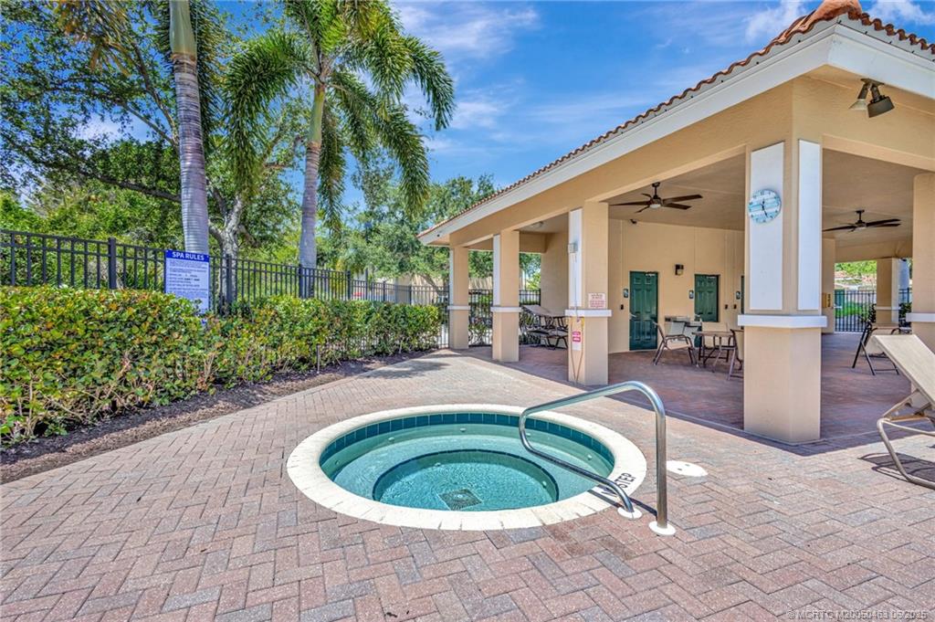 144 Southwest Otter Run Place Stuart, FL 34997 - Photo 17 of 20 a view of a house with backyard and swimming pool