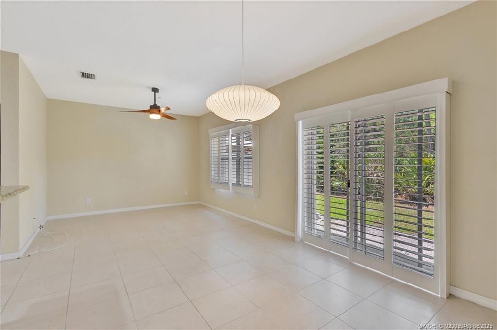144 Southwest Otter Run Place Stuart, FL 34997 - Photo 5 of 20 a view of an empty room with a window