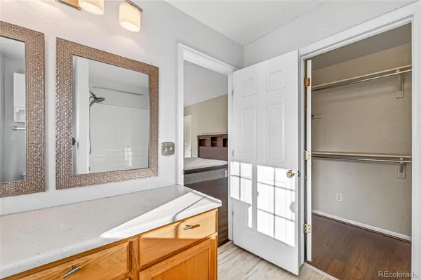 a bathroom with a tub and a mirror