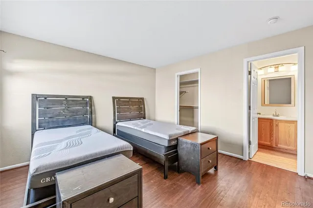 a bedroom with a bed and a closet