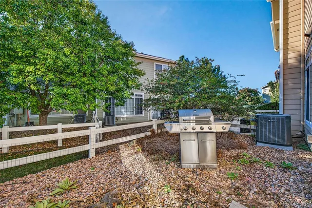 a view of a backyard with sitting area