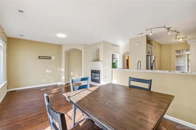 a view of a dining room with furniture and wooden floor