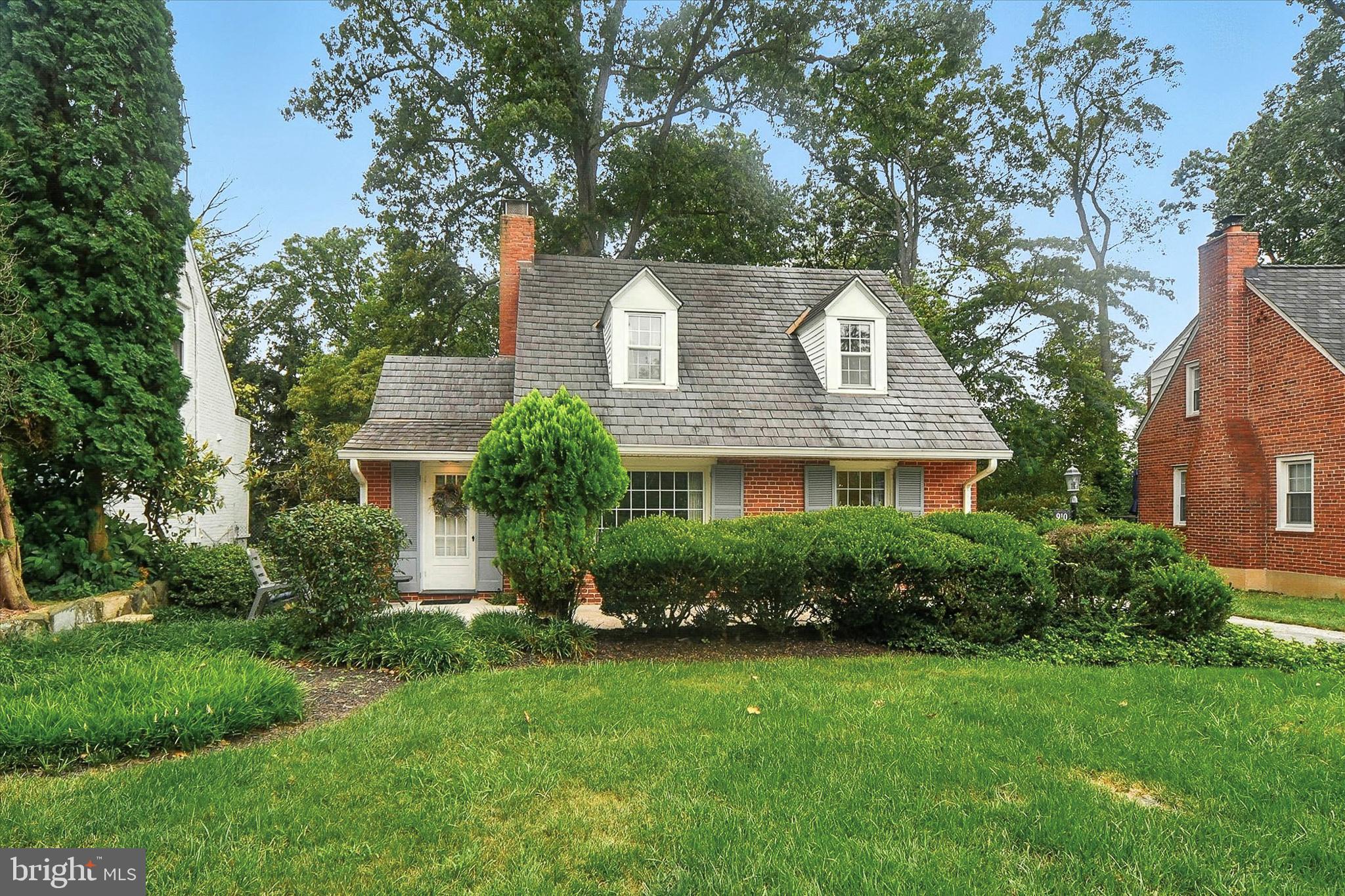 910 Adana Road Baltimore, MD 21208 - Photo 1 of 31 front view of a house with a yard