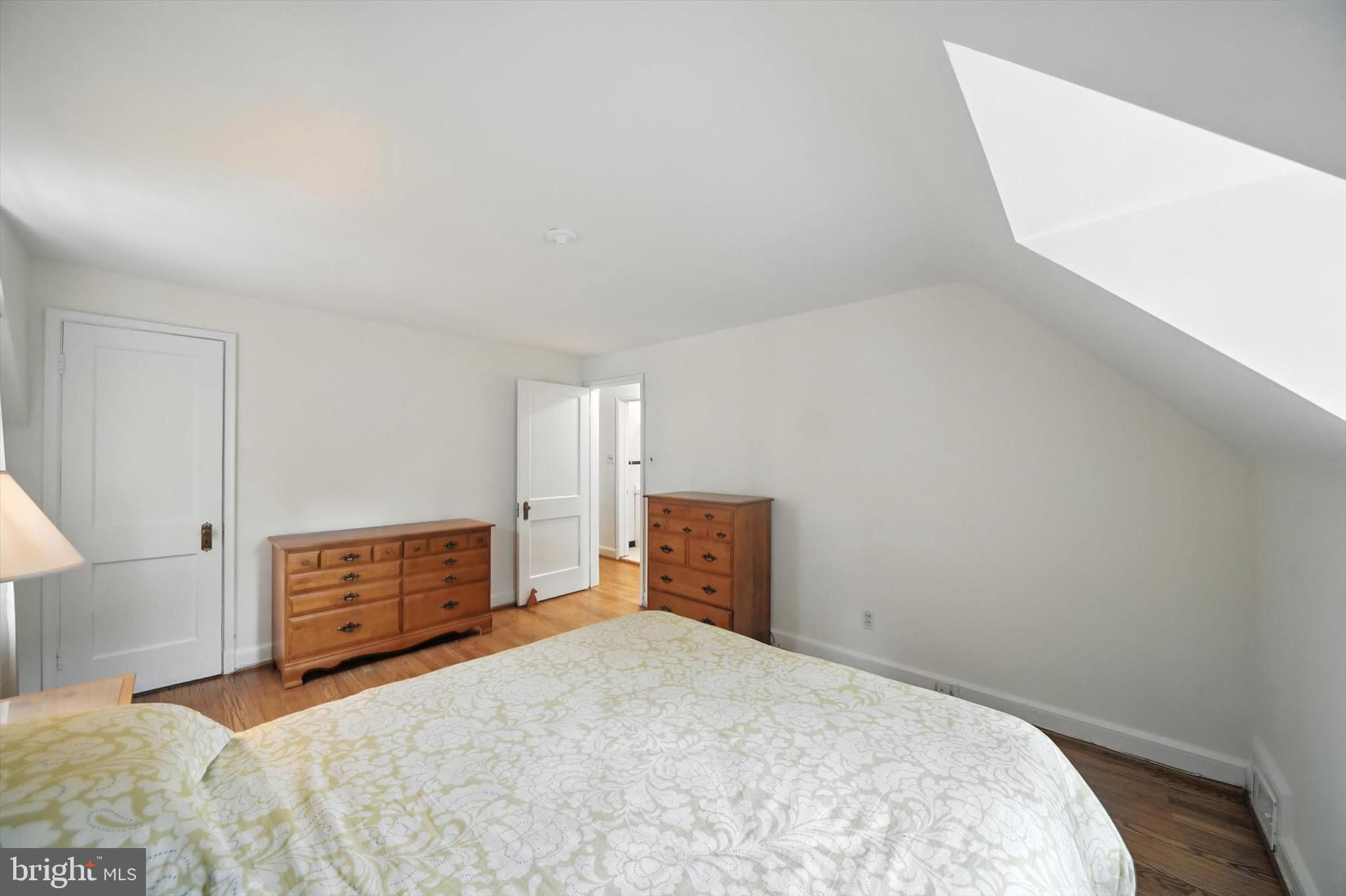 910 Adana Road Baltimore, MD 21208 - Photo 24 of 31 a bedroom with a bed and cabinets