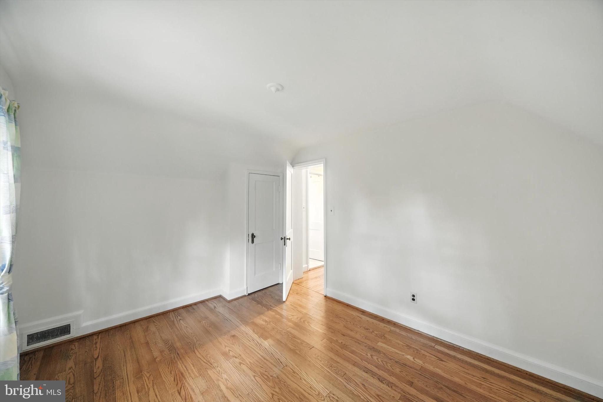 910 Adana Road Baltimore, MD 21208 - Photo 25 of 31 a view of an empty room and wooden floor