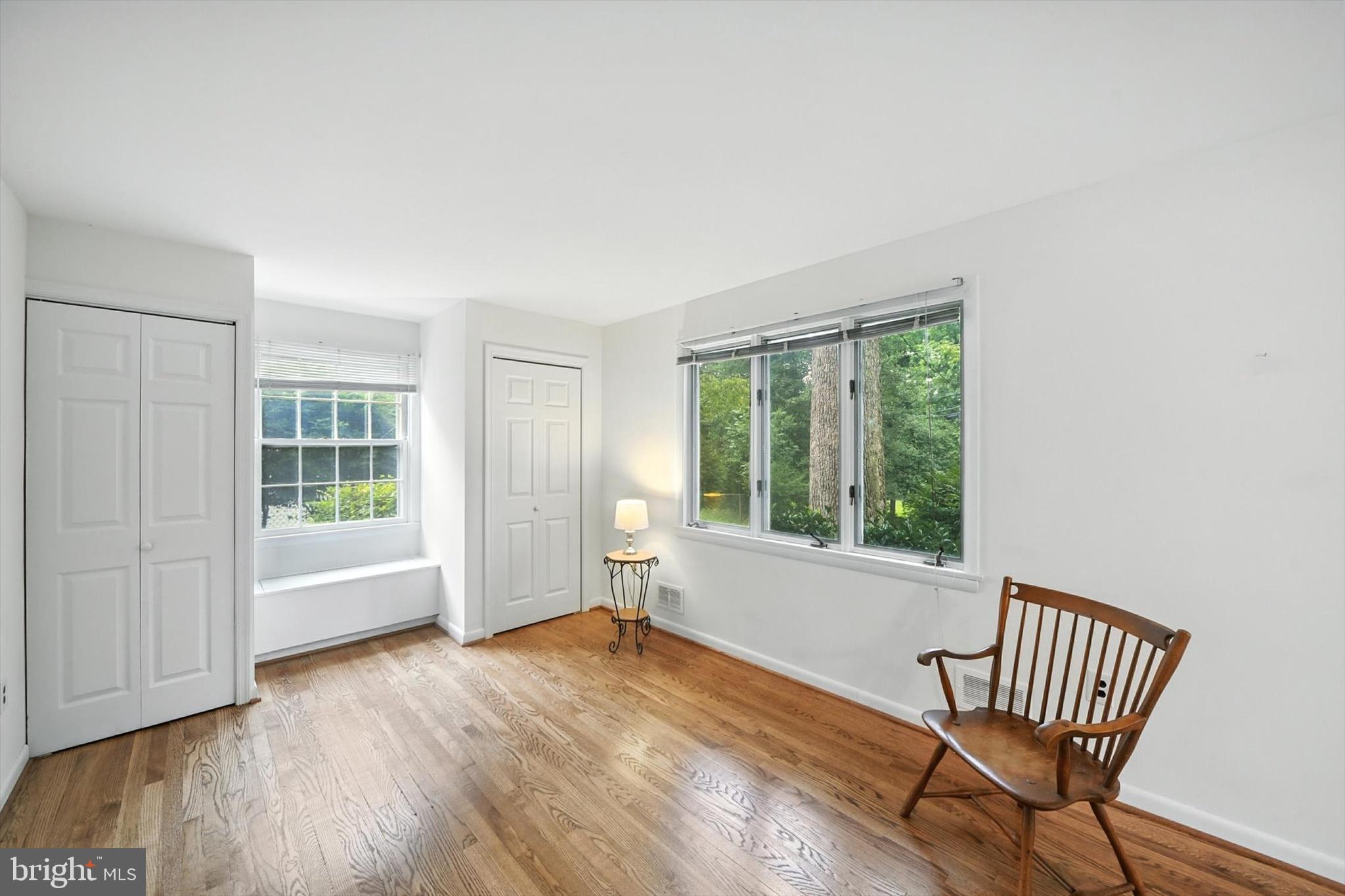 910 Adana Road Baltimore, MD 21208 - Photo 7 of 31 a view of an empty room with wooden floor and a window