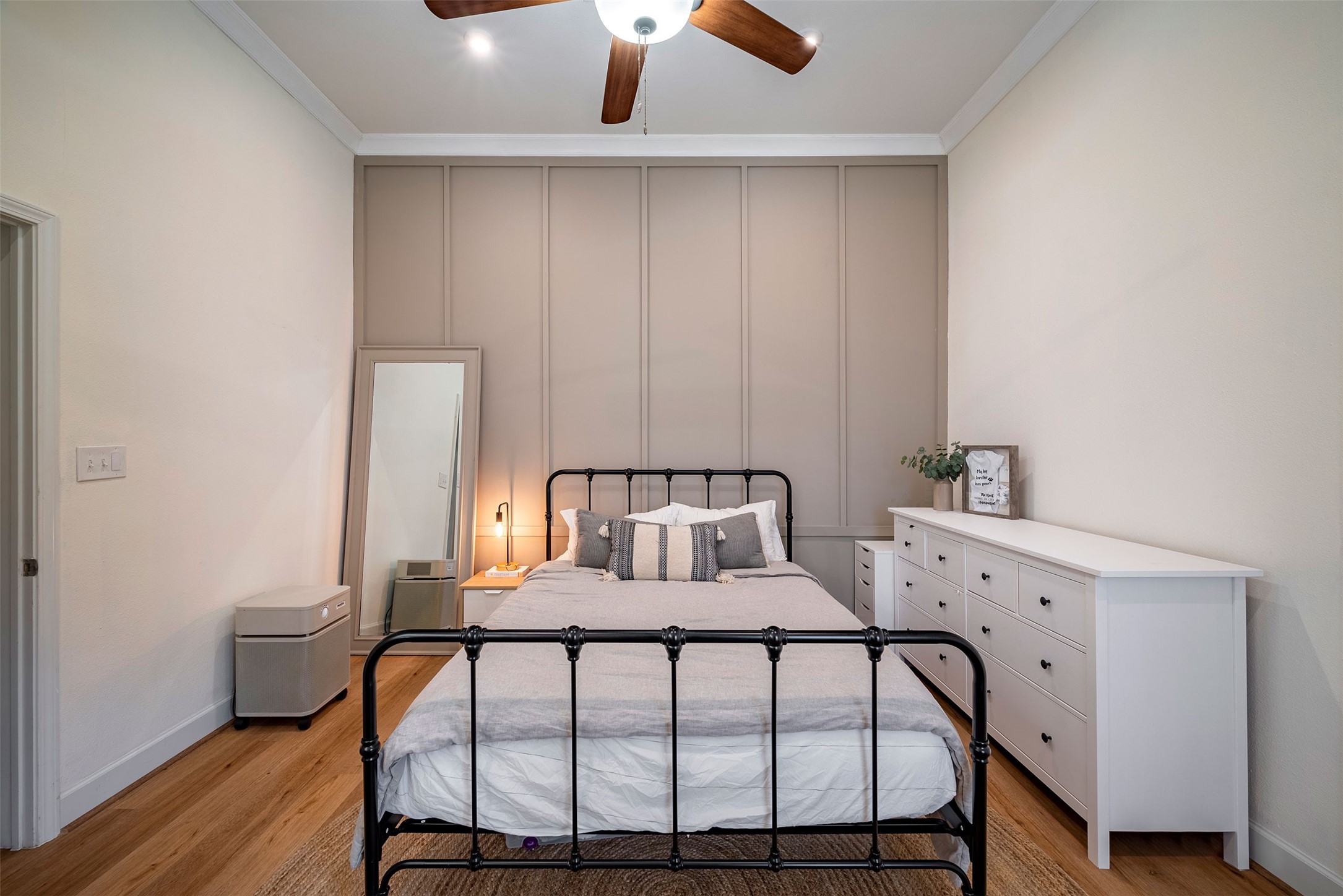 1924 Gano Street Houston, TX 77009 - Photo 12 of 18 a bedroom with a bed and wooden floor