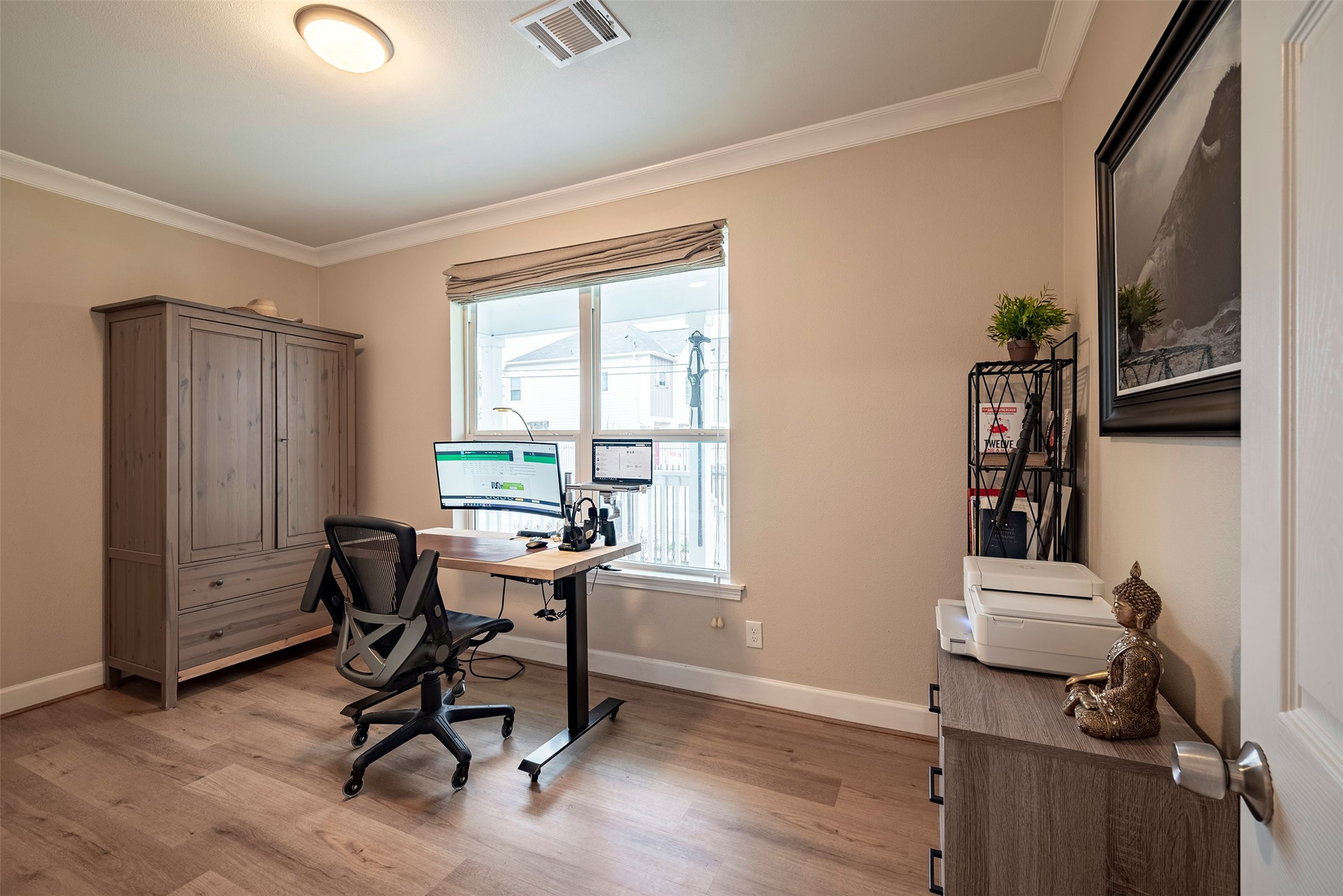 1924 Gano Street Houston, TX 77009 - Photo 15 of 18 a view of a workspace with furniture and a window