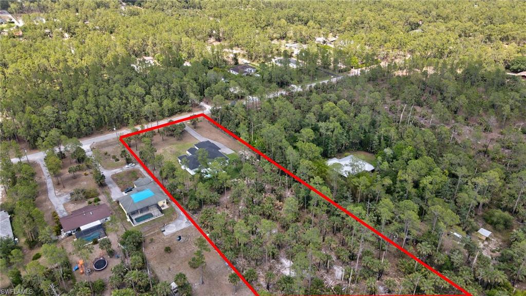 3390 12th Avenue Southeast Naples, FL 34117 - Photo 43 of 48 Aerial view of property's location with a heavily wooded area and property parcel outlined