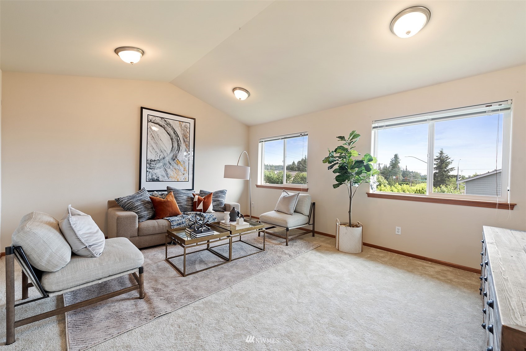 21112 39th Avenue Southeast Bothell, WA 98021 - Photo 25 of 33 a living room with furniture and a potted plant
