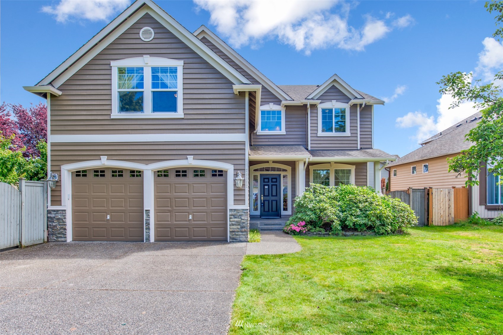 21112 39th Avenue Southeast Bothell, WA 98021 - Photo 33 of 33 a front view of a house with a yard and garage
