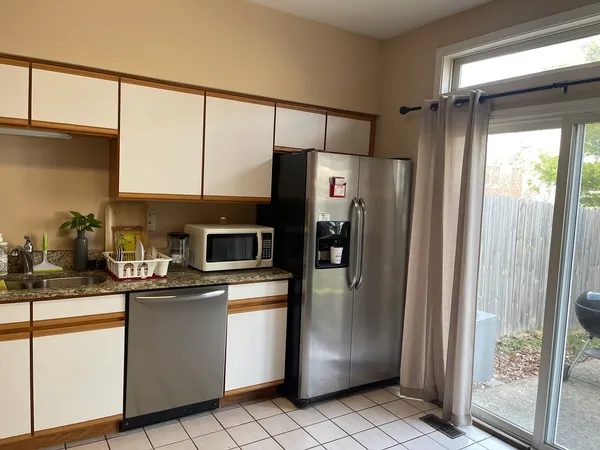 a kitchen with stainless steel appliances a refrigerator and a sink