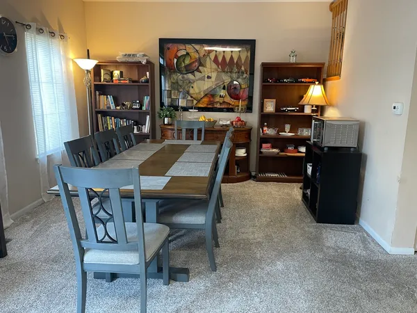 a view of a dining room with furniture