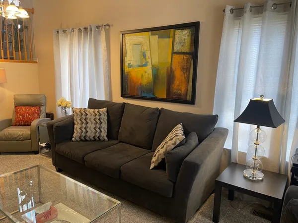 a living room with furniture and a window