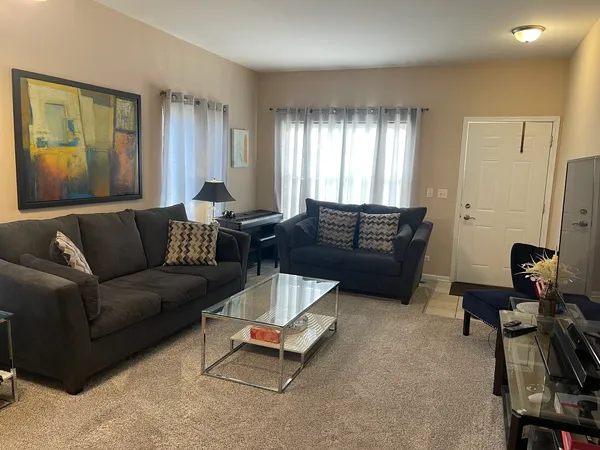 a living room with furniture and a window