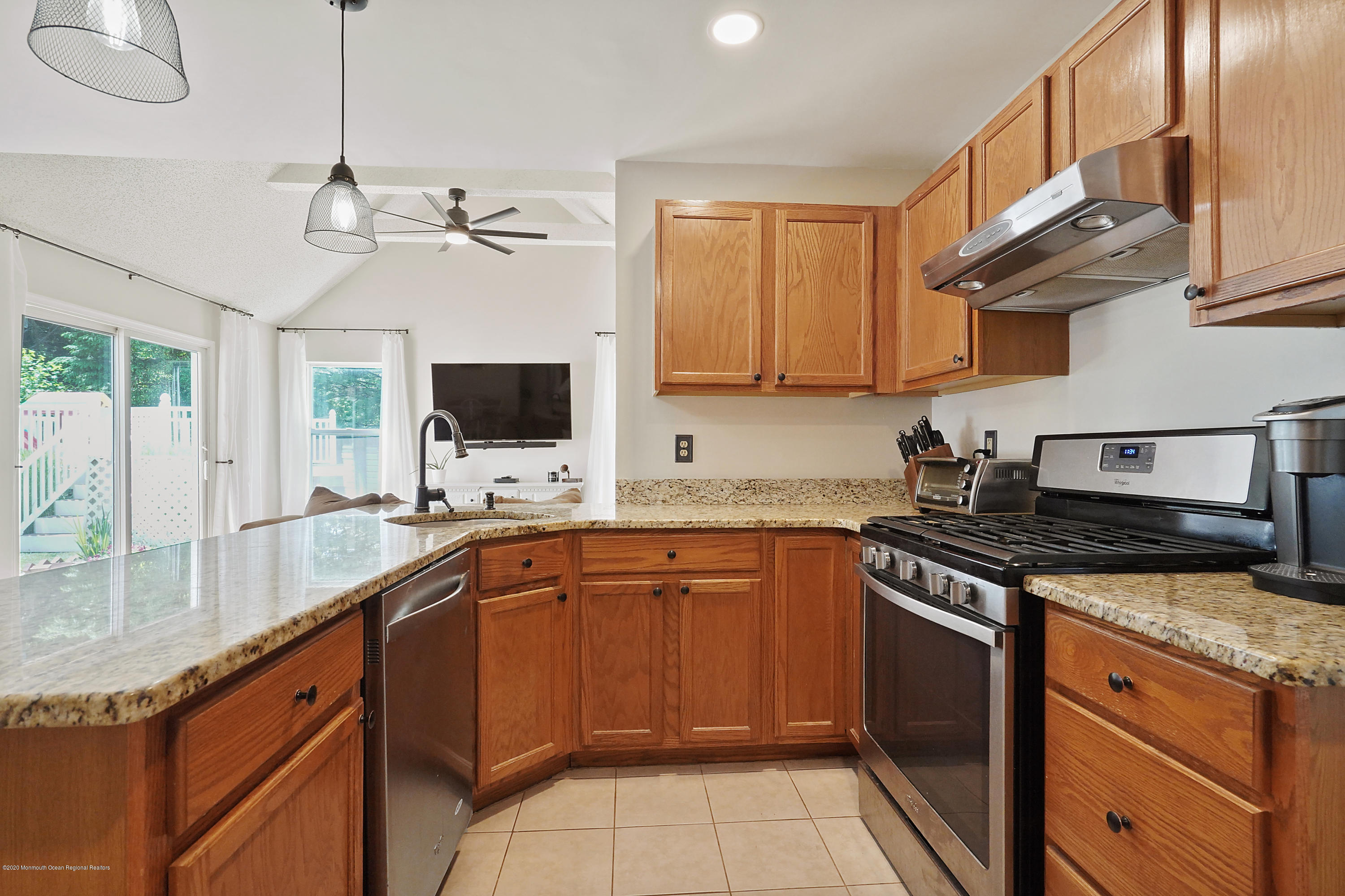 23 Crater Lake Road Howell, NJ 07731 - Photo 12 of 34 a kitchen with stainless steel appliances granite countertop a sink and a stove