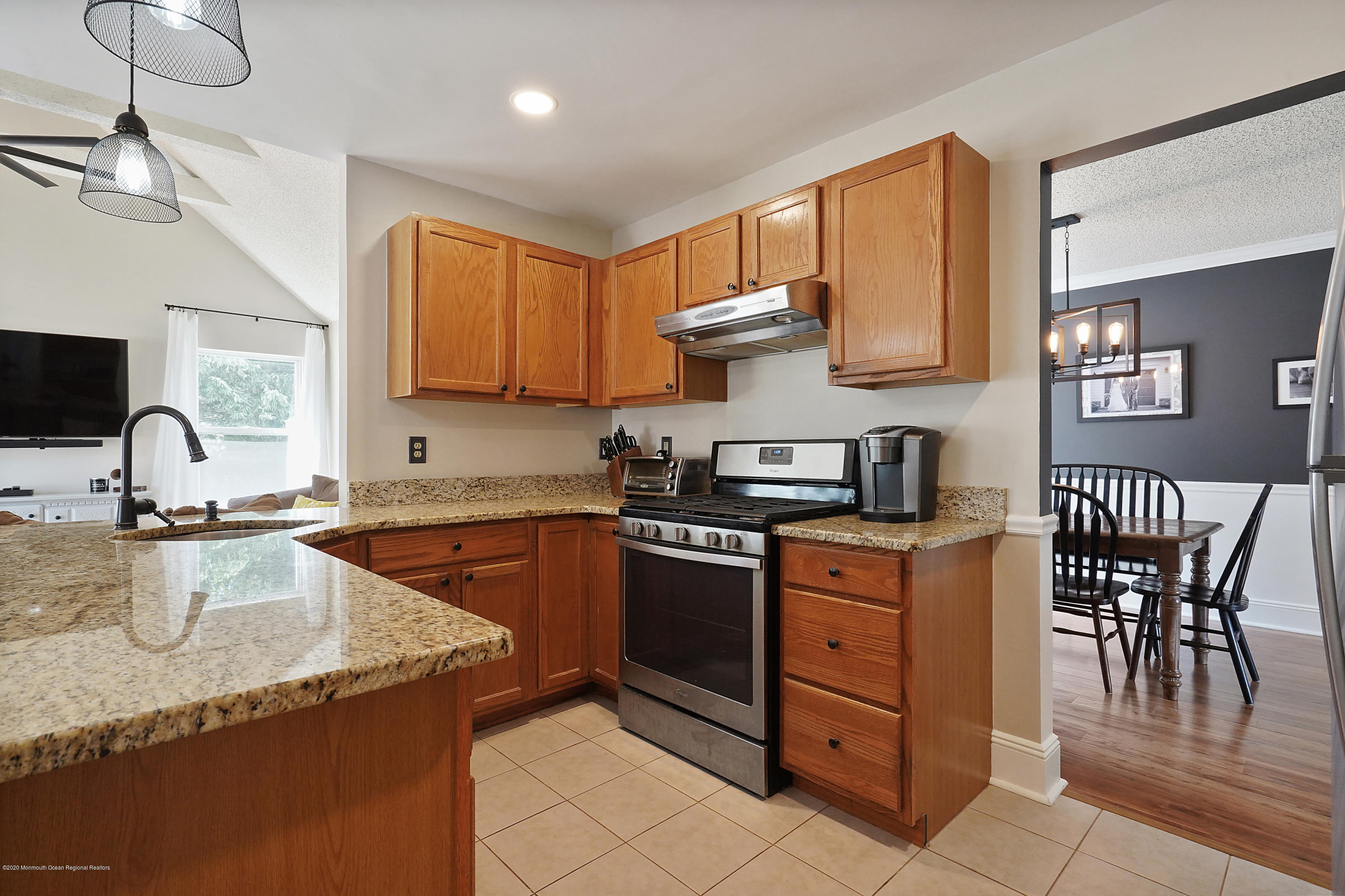 23 Crater Lake Road Howell, NJ 07731 - Photo 14 of 34 a kitchen with stainless steel appliances granite countertop a stove a sink and a microwave