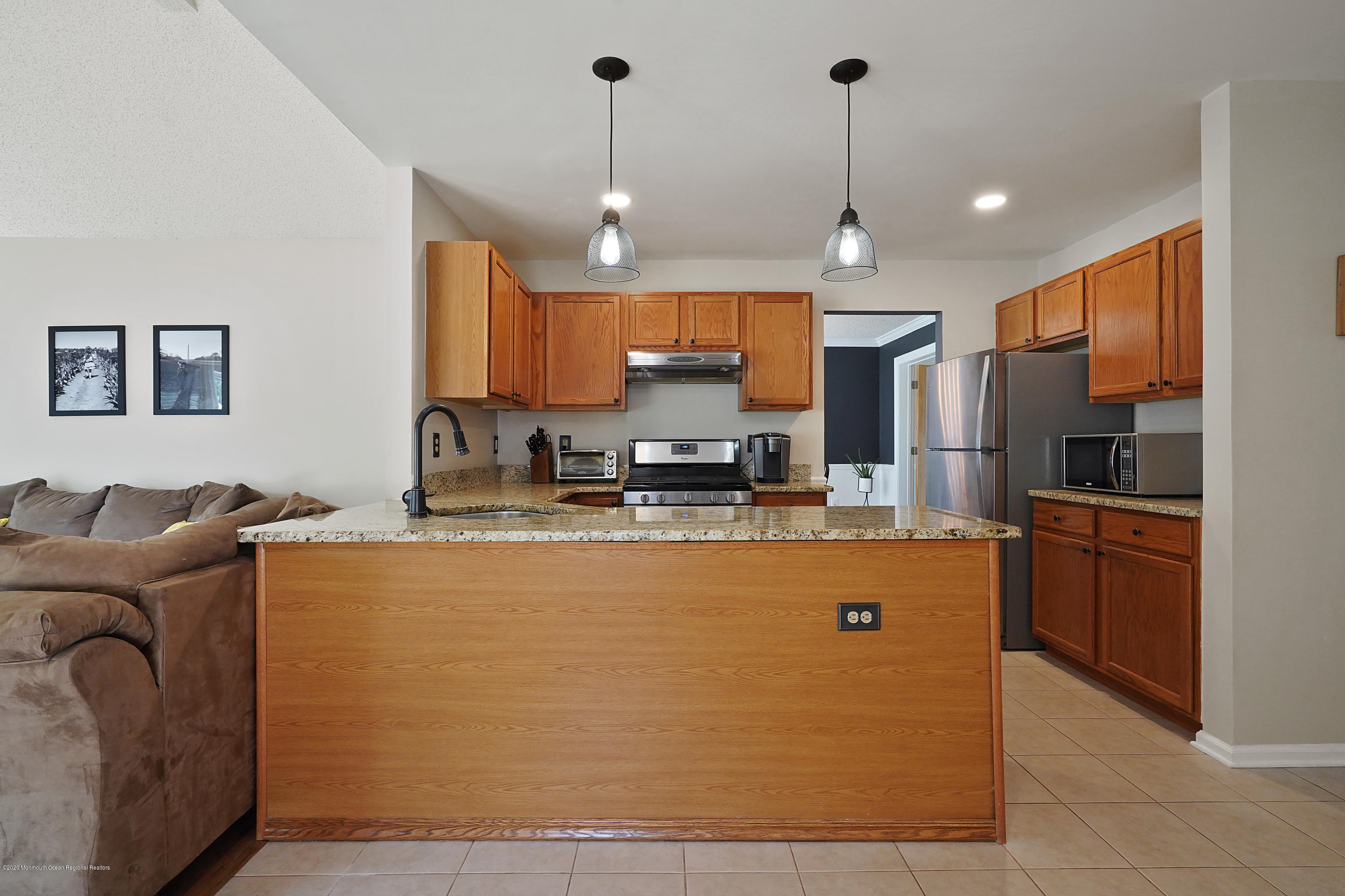 23 Crater Lake Road Howell, NJ 07731 - Photo 15 of 34 a large kitchen with stainless steel appliances granite countertop a sink a stove a refrigerator and a refrigerator