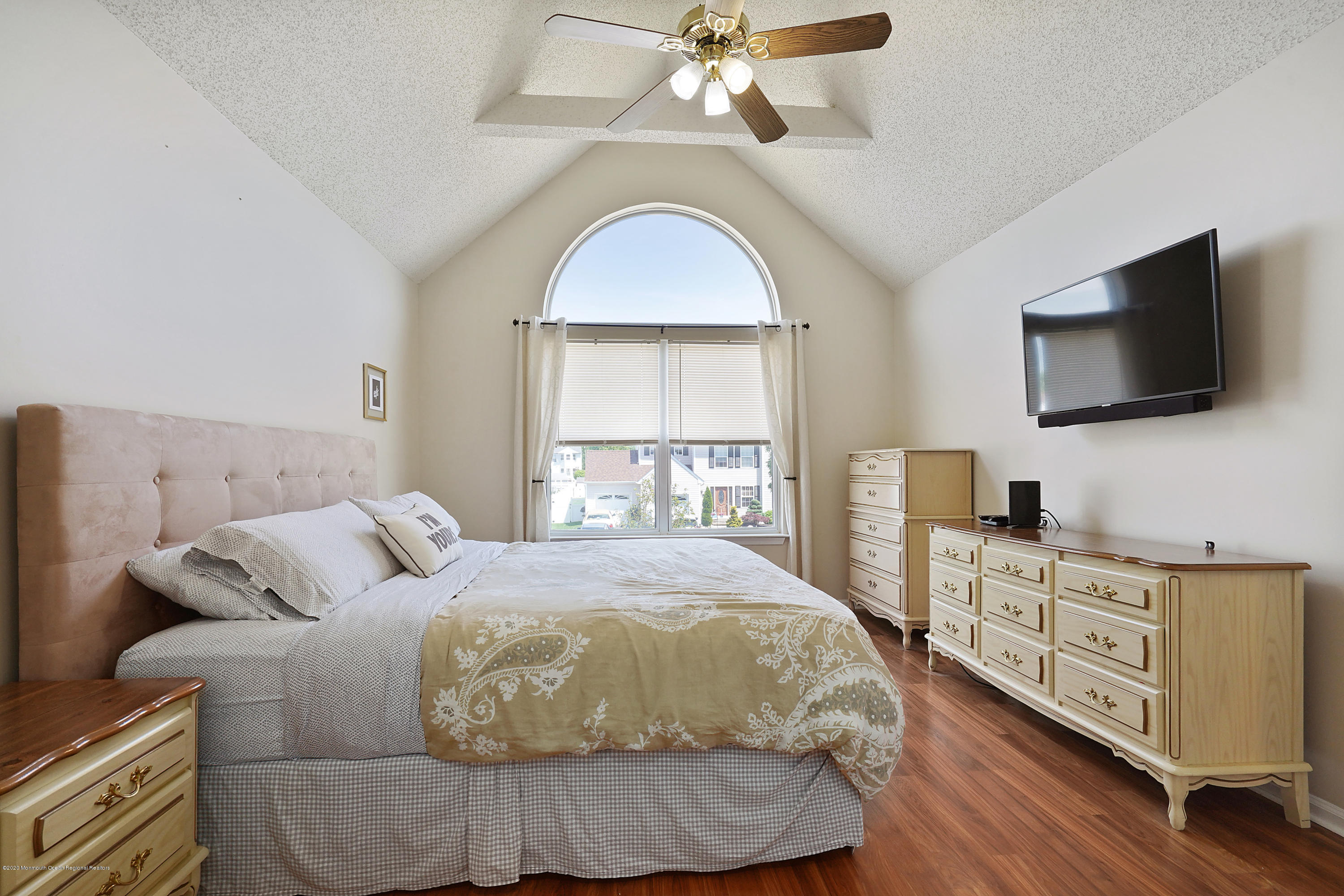 23 Crater Lake Road Howell, NJ 07731 - Photo 19 of 34 a bedroom with a bed and a flat screen tv