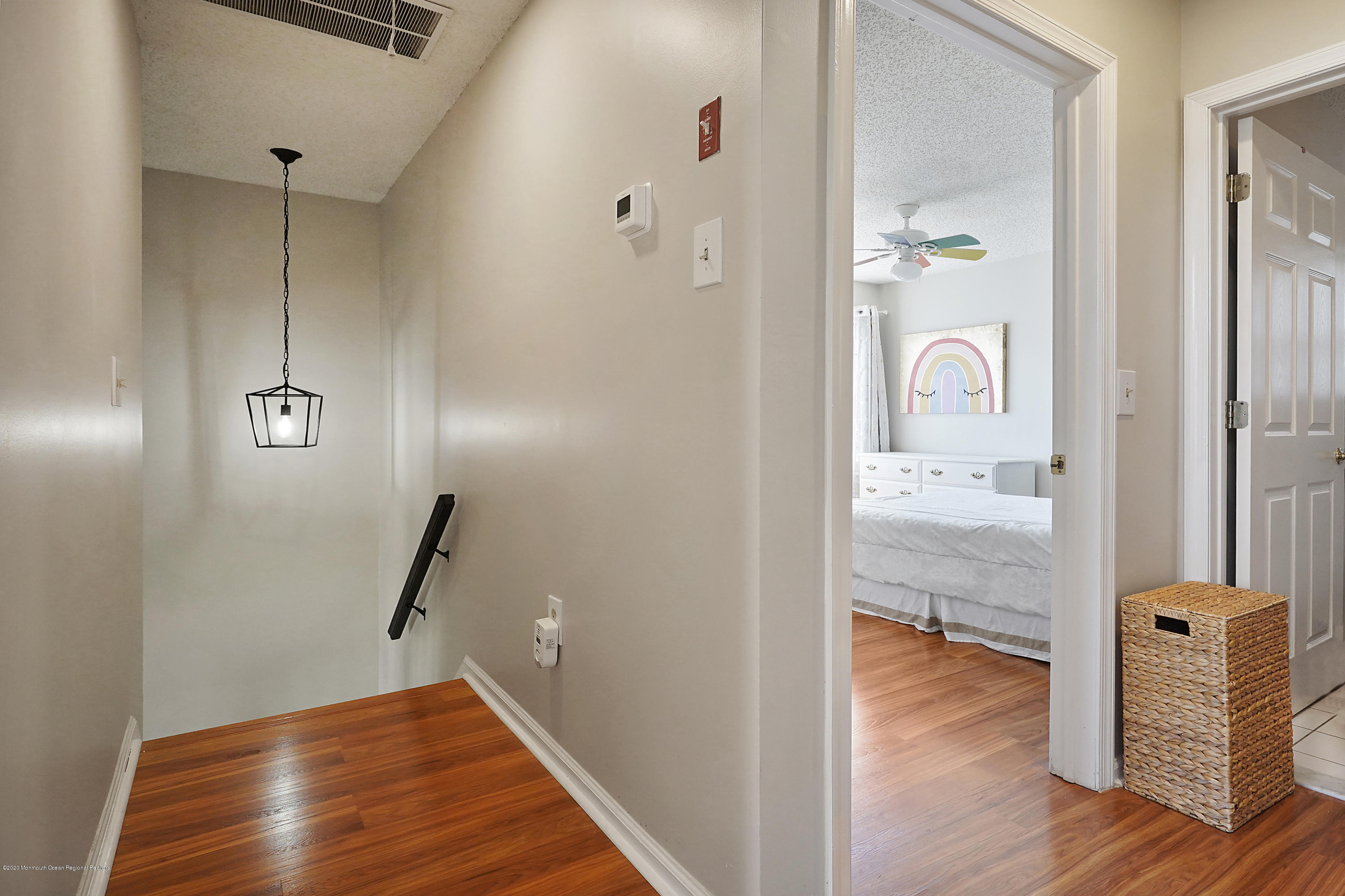 23 Crater Lake Road Howell, NJ 07731 - Photo 25 of 34 wooden floor with a view of bathroom