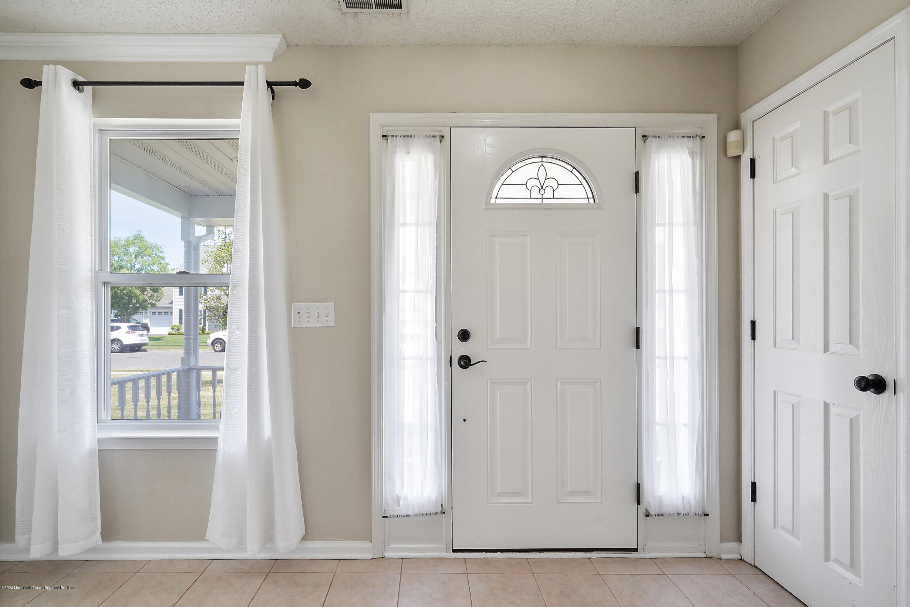 23 Crater Lake Road Howell, NJ 07731 - Photo 4 of 34 a view of entryway with wooden floor