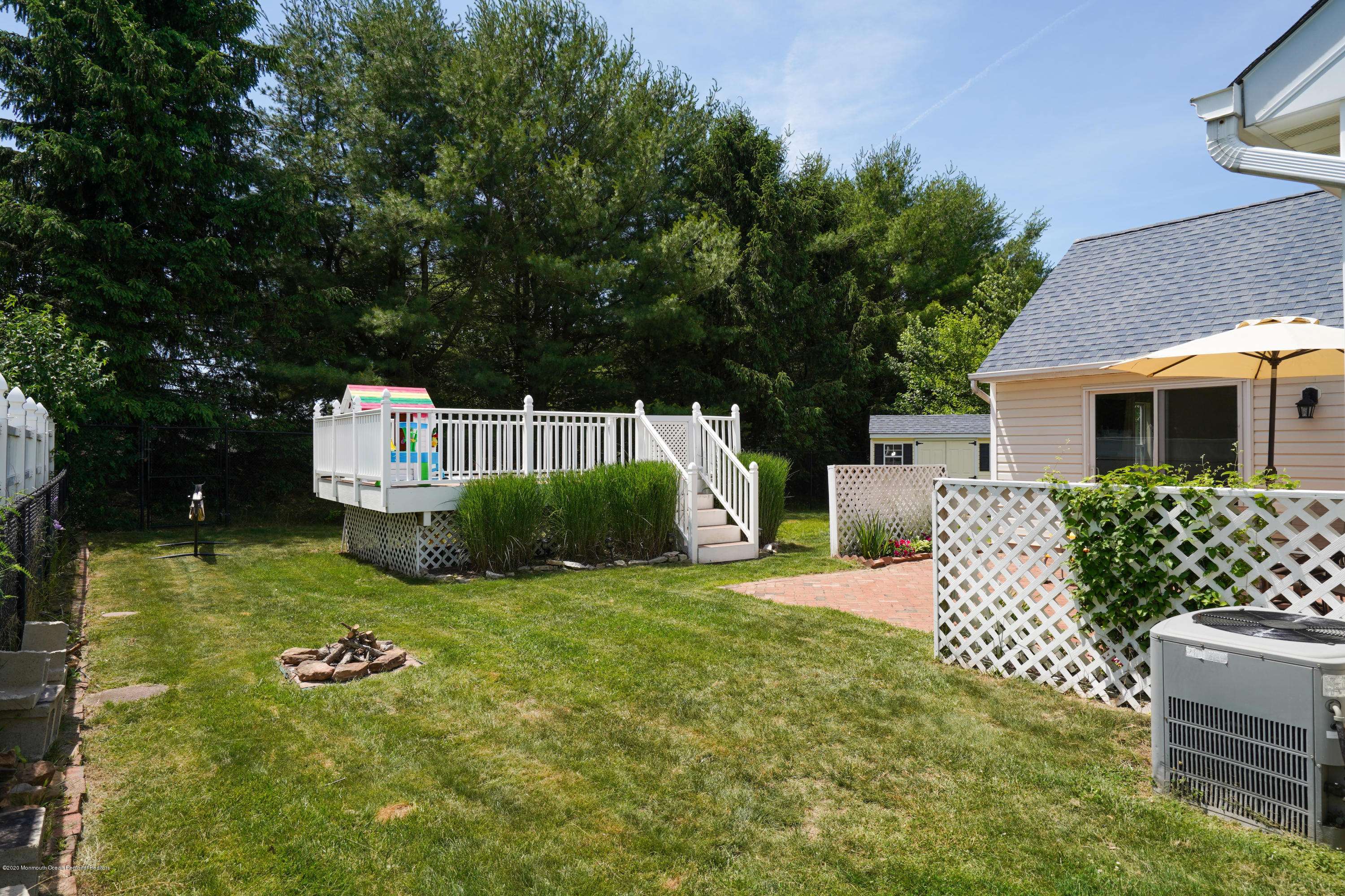 23 Crater Lake Road Howell, NJ 07731 - Photo 31 of 34 a view of backyard with a garden and entertaining space