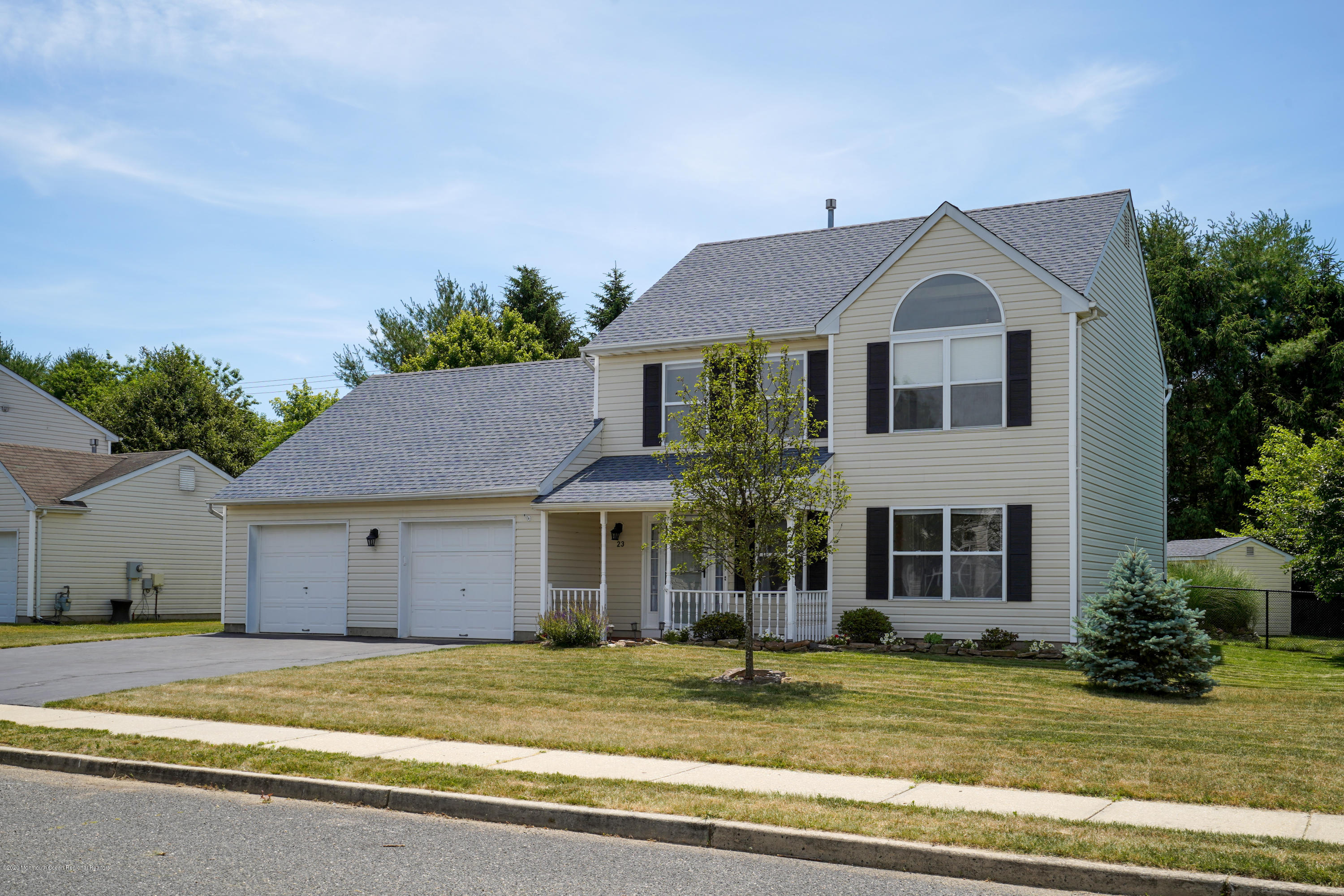 23 Crater Lake Road Howell, NJ 07731 - Photo 34 of 34 a view of a house with a patio and a yard