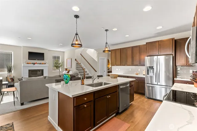 a kitchen with a sink stove and refrigerator