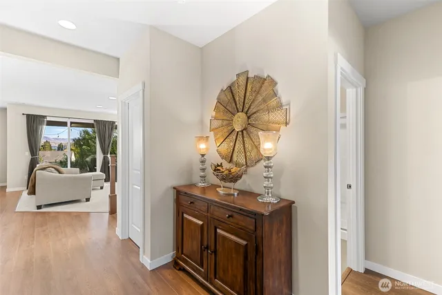 a view of living room with furniture and wooden floor