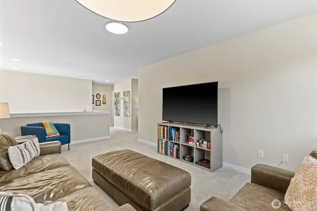 a living room with furniture and a shelf