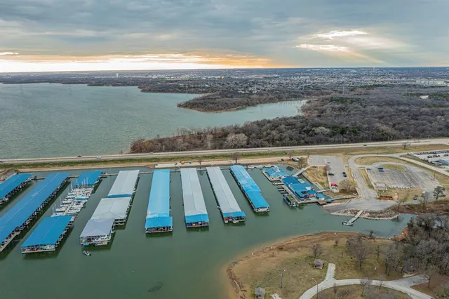 a view of a swimming pool with a yard