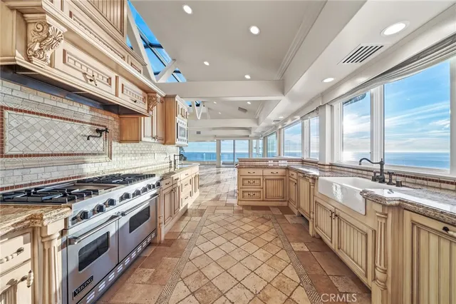 a spacious bathroom with a granite countertop sink and a mirror