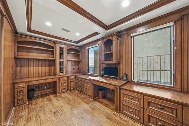 a large bedroom with windows