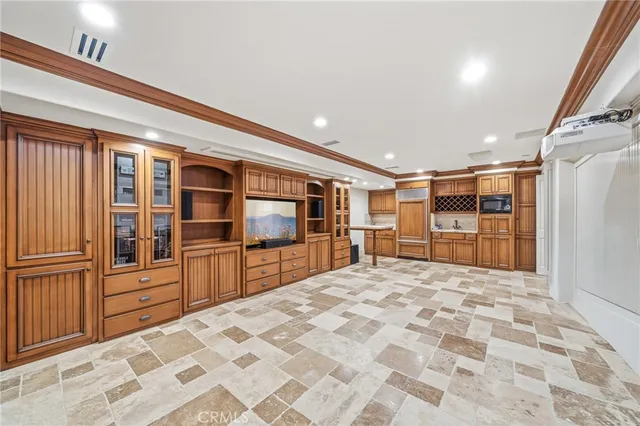 a bathroom with a granite countertop sink a toilet a mirror and shower