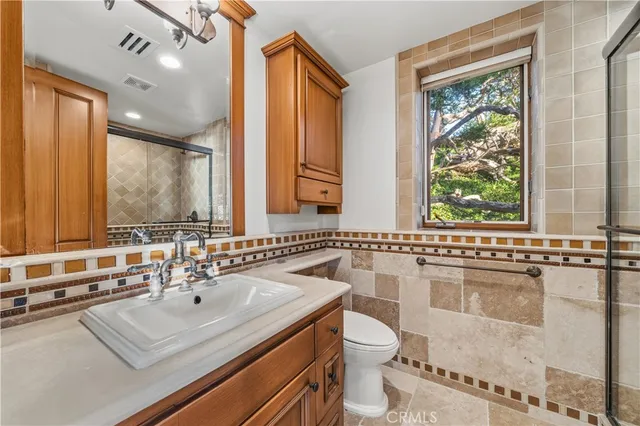 an aerial view of residential building and ocean