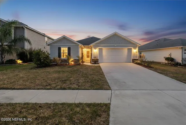 a front view of a house with yard