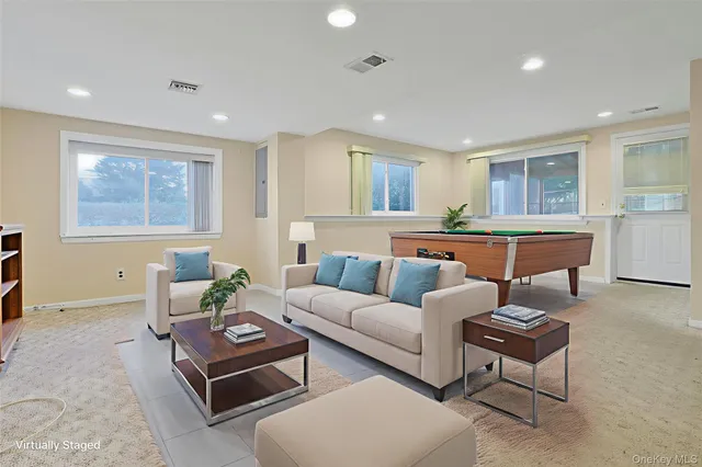 a living room with furniture and a table