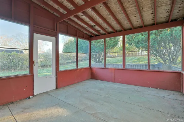 a swimming pool with an outdoor seating space