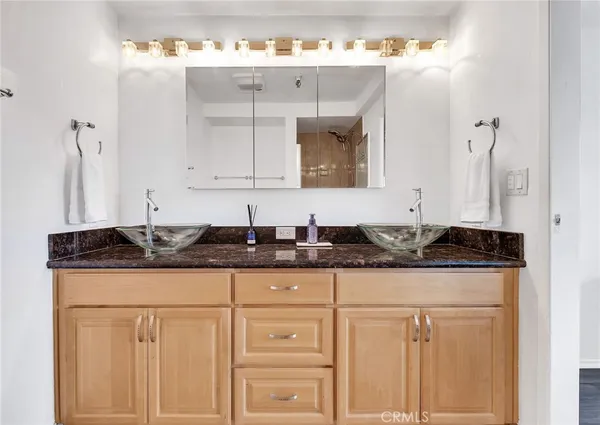 a kitchen with granite countertop a sink and cabinets