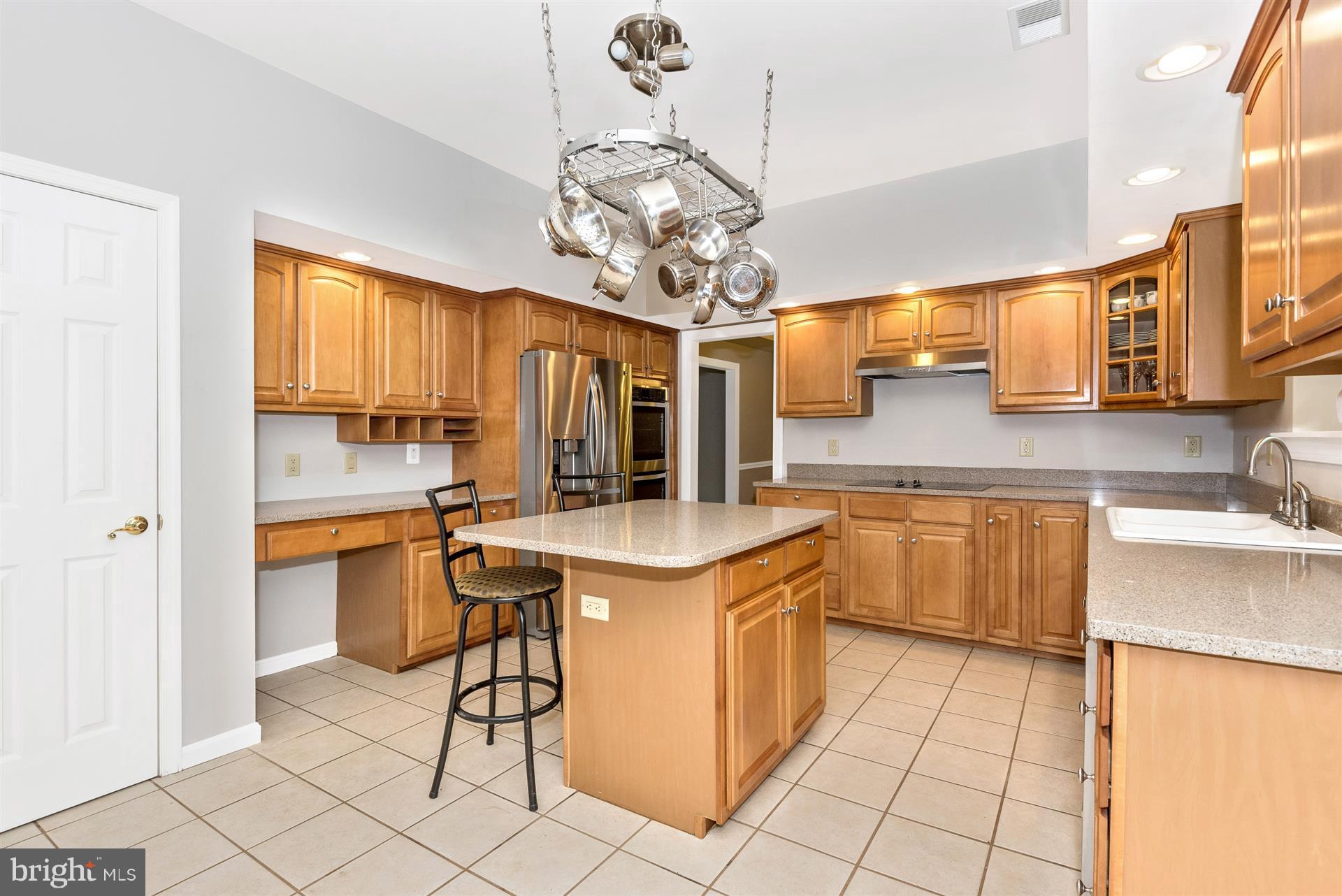 14435 Unionville Road Mount Airy, MD 21771 - Photo 12 of 28 a kitchen with stainless steel appliances granite countertop a sink and a refrigerator