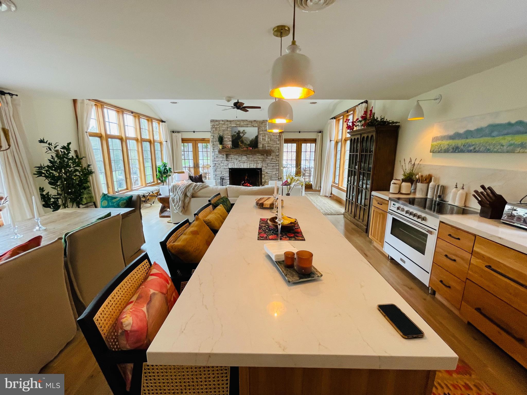 614 Graystones Jeras Road Albrightsville, PA 18210 - Photo 21 of 30 a kitchen with stainless steel appliances granite countertop a stove a refrigerator a sink dishwasher a dining table and chairs with the kitchen view