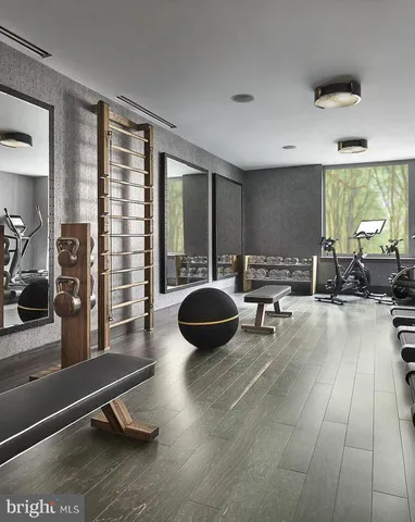 a living room filled with furniture and a flat screen tv