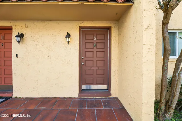 a view of a entryway door front of a house