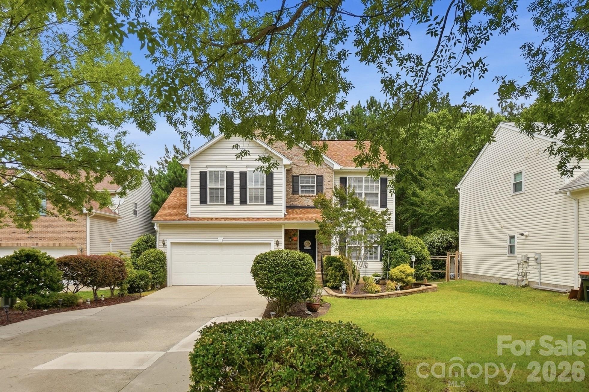 442 Sugar Maple Drive Tega Cay, SC 29708 - Photo 1 of 48 a front view of a house with garden