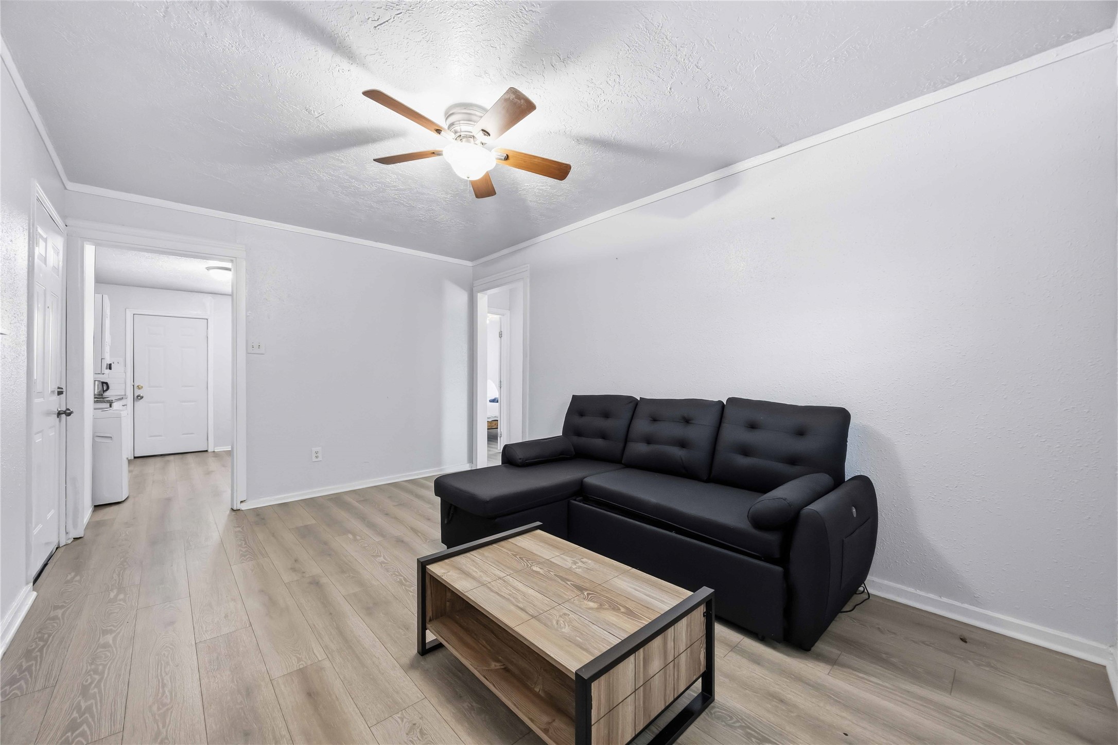 6726 Burkett Street Houston, TX 77021 - Photo 7 of 18 a living room with furniture and a wooden floor