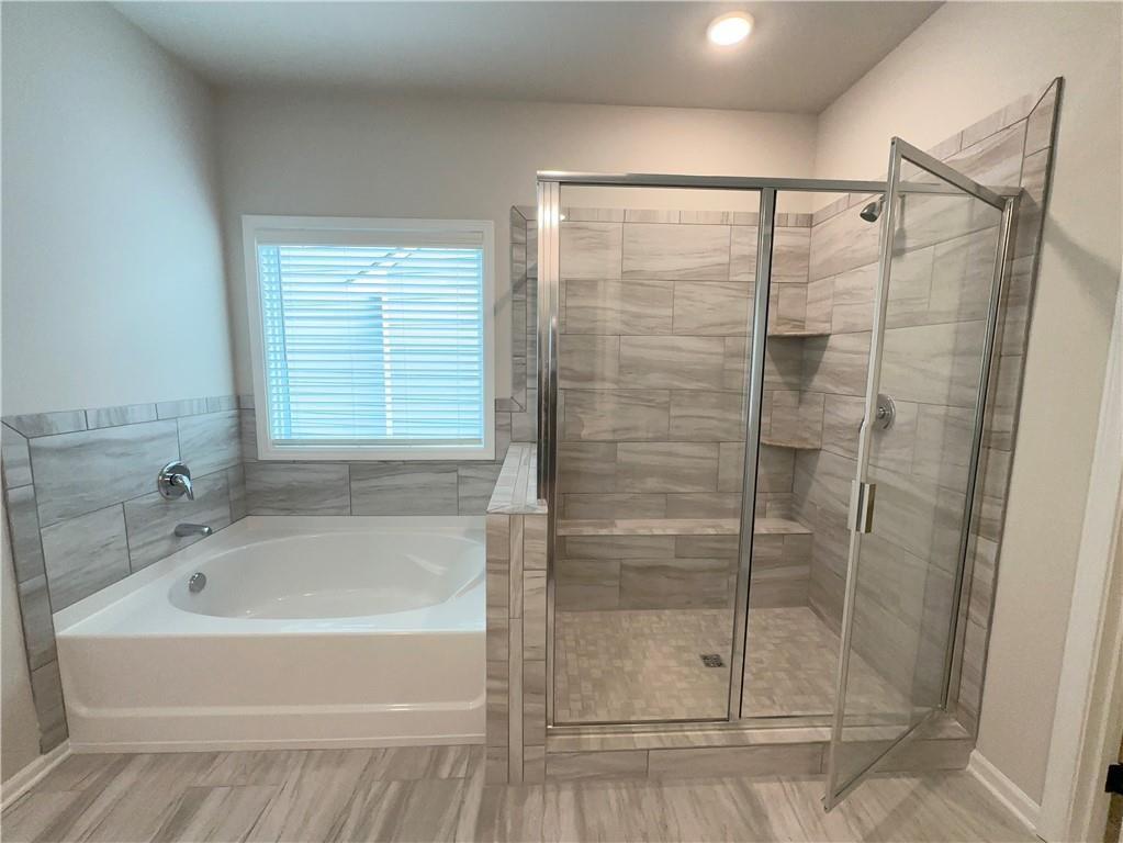 345 Rodeo Drive Auburn, GA 30011 - Photo 17 of 22 a bathroom with a shower and a sink