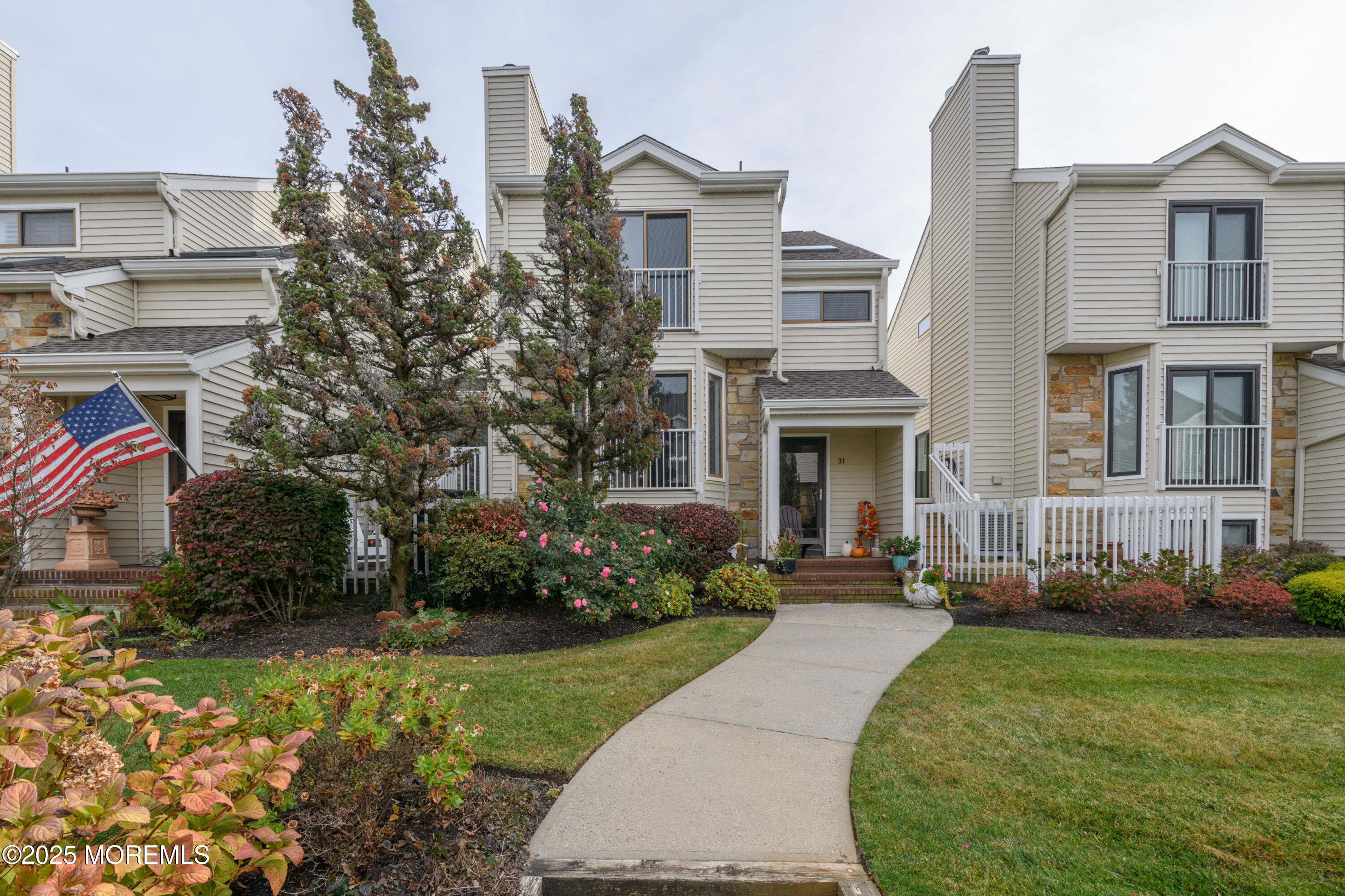 580 Patten Avenue, Unit 31 Long Branch, NJ 07740 - Photo 1 of 30 a front view of a house with garden